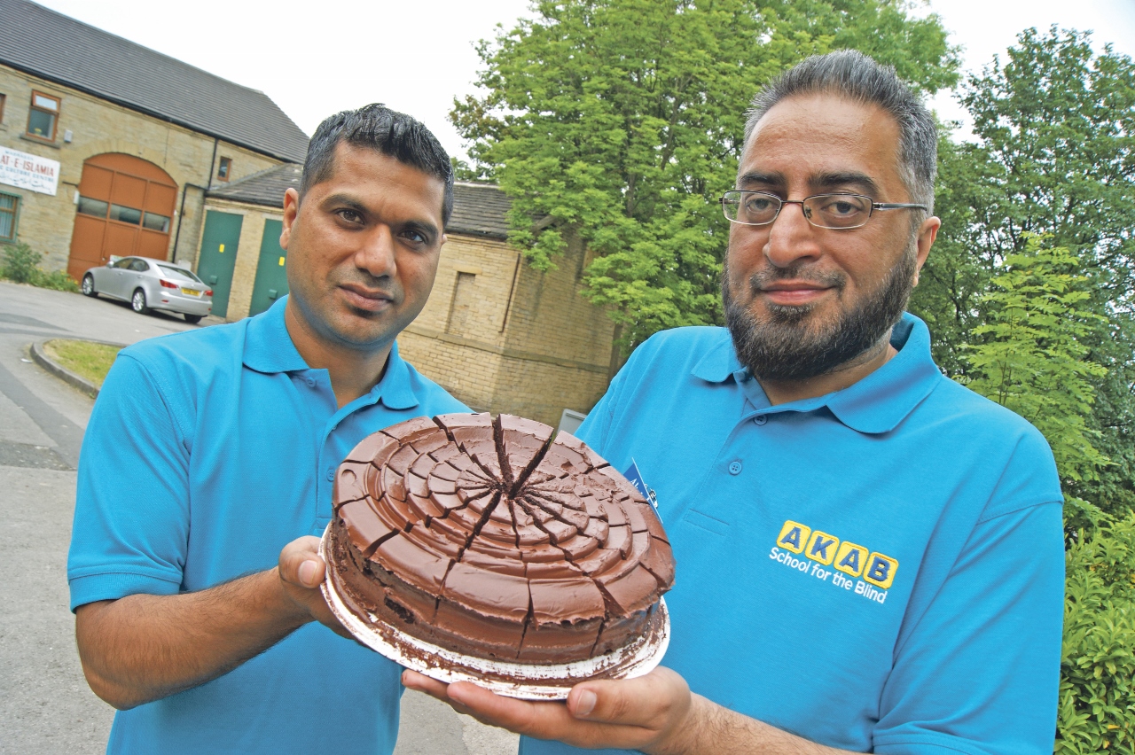 SWEET: Abdul Satar and Amjad Akram have been selling chocolate cakes to locals to raise money for charity