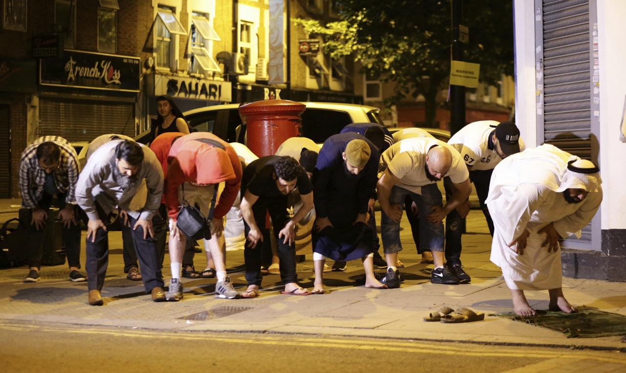 MUSLIM WELFARE HOUSE: Members of the north London mosque joined in prayer following aftermath of attack