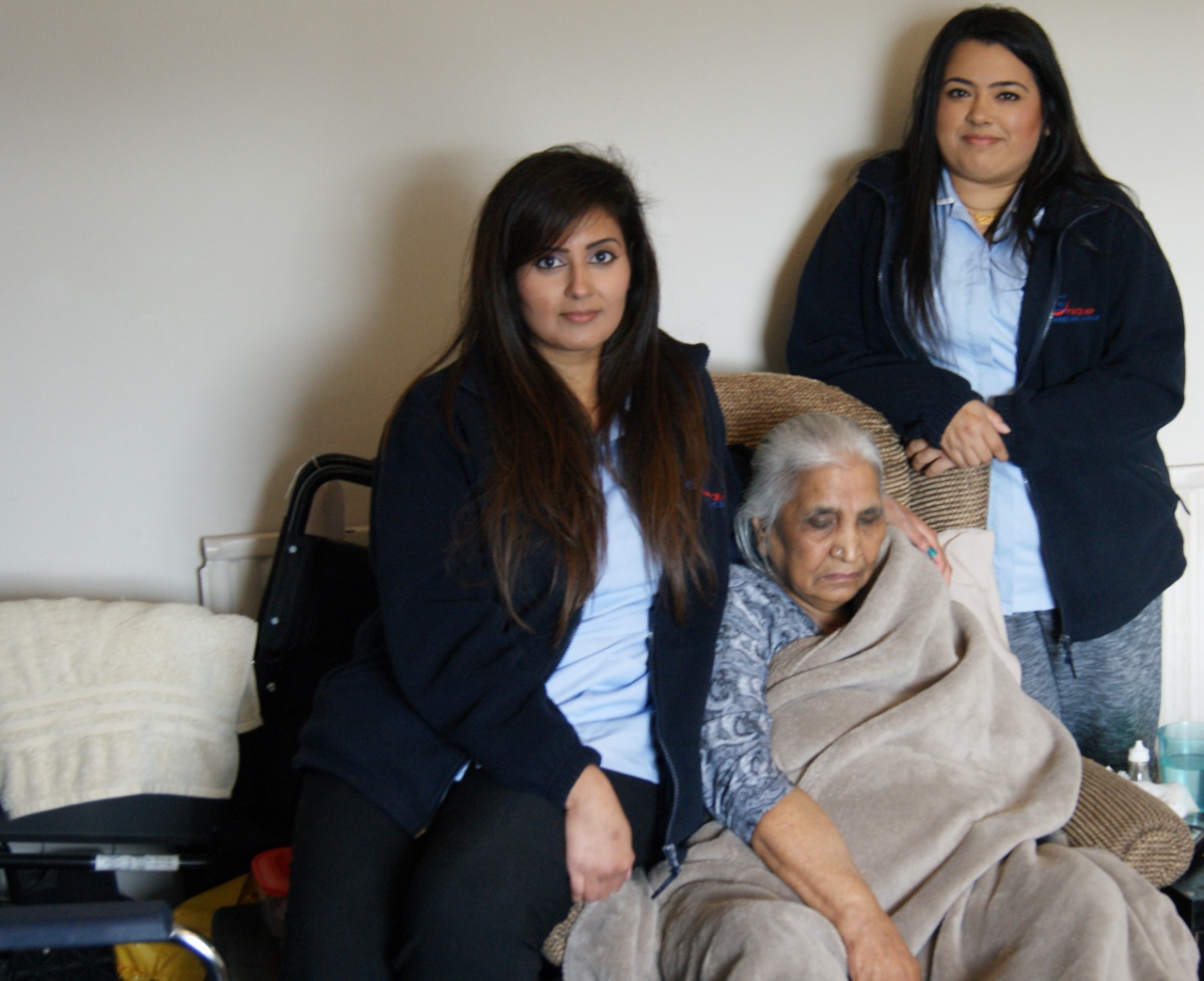 SUPPORT: A happy Care Unique service user with two of their care workers who are supplying smiles to the people of Bradford and beyond
