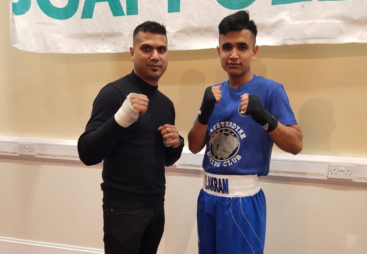 WINNER: Zahir Akram who was successful in his first boxing bout in Bradford, pictured her with his uncle Amjad Akram