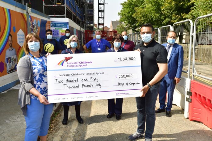 Leicester's Hospitals' acting CEO Rebecca Brown accepting a donation of £250,000 from Drop of Compassion's Haroon Shaikh 2_19