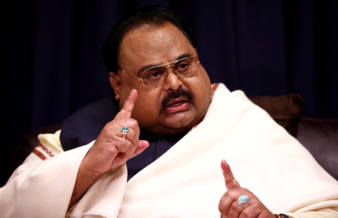 FILE PHOTO: Founder of Pakistan's MQM party, Altaf Hussain, reacts during an interview at the party's offices in London